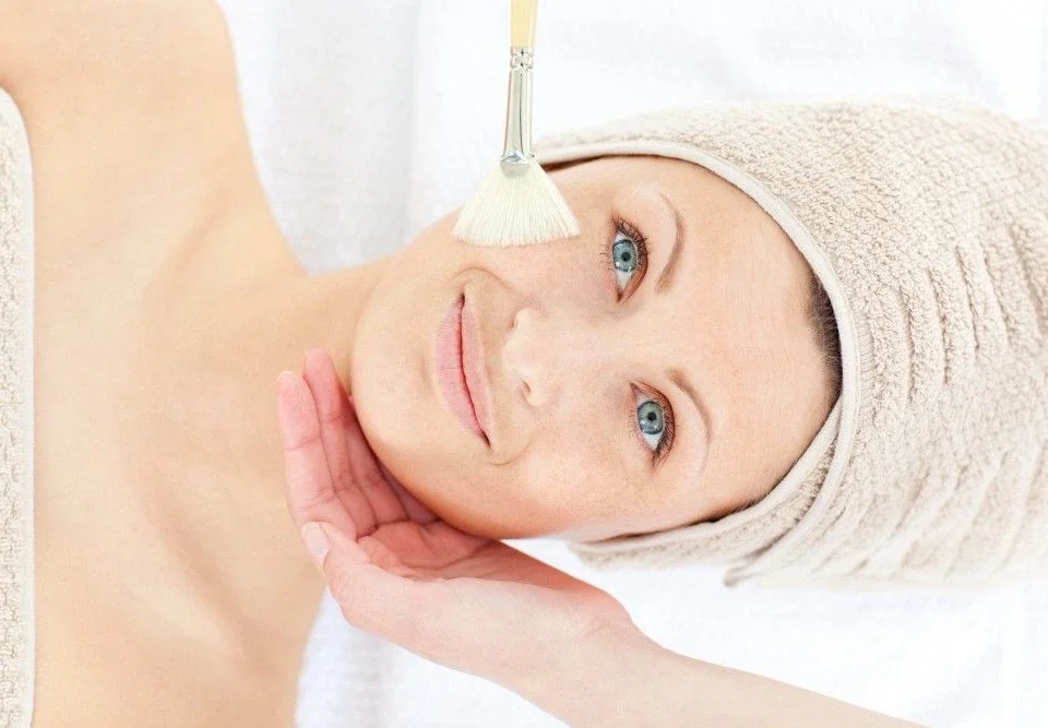 Woman with radiant skin after chemical peel for pimple marks